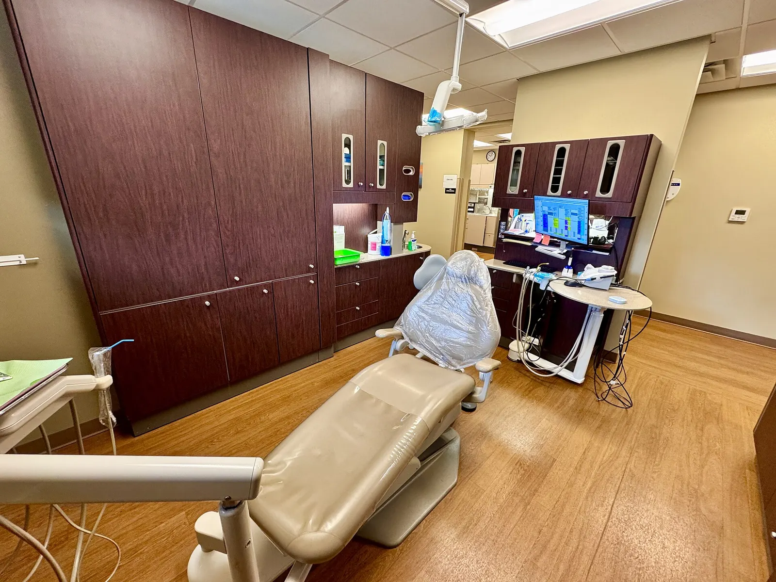 A dental treatment room with a patient chair